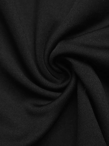 Detailed macro view of the soft black knitted fabric texture on the short sleeve dress