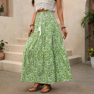 Bohemian tiered paisley maxi skirt with green and white patterns and tassel drawstring waist