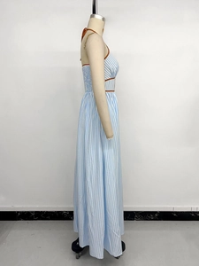 Detail of blue striped halter maxi dress with smocked side and contrast piping trim