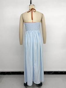 Detail of blue and white striped halter maxi dress with smocked back and orange ties