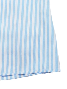Detailed macro view of blue and white striped fabric texture and hemline stitching detail