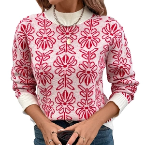 Pink Fair Isle knit sweater with red floral jacquard pattern and a chic mock neck