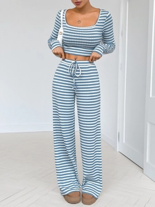Detail of blue and white striped long sleeve crop top and matching wide leg pants