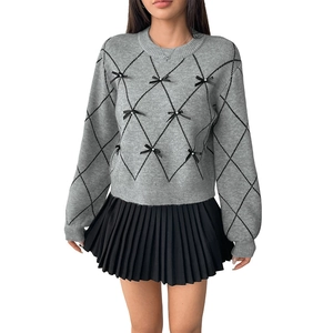Women's grey knit sweater with black argyle pattern and bow accents in preppy style