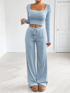 Close-up of blue and white striped ribbed lounge set with cropped top and drawstring waist