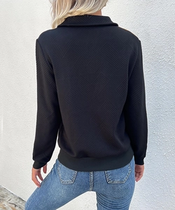 Detailed back view of a black sweatshirt featuring unique geometric textured diamond patterns