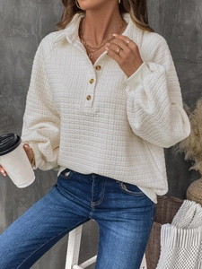 Women's cream waffle knit polo sweatshirt with wooden buttons and ribbed cuffs