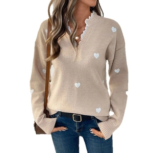 Women's V-neck knit sweater in beige with white heart patterns and lace stitching detail