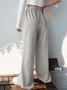 Rear view of grey wide-leg lounge pants showing the elastic high waist and soft drape
