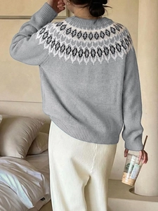 Rear view of women's grey Fair Isle sweater with ethnic patterns and ribbed cuffs