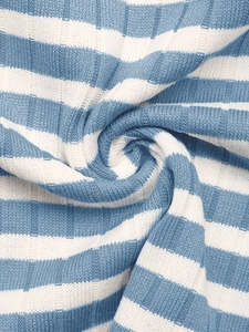 Macro shot of striped knit fabric texture with soft ribbed blue and white pattern