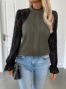 Detail of olive green shirt featuring pleated front and floral black lace sleeves