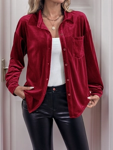 Detail view of burgundy velvet long sleeve shirt with classic collar and front pocket