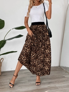 Detail of high-waist elastic band and leopard print pleats on this elegant maxi skirt