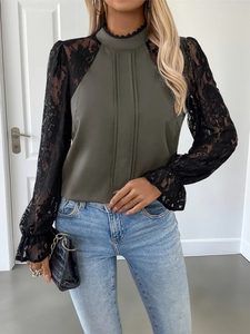 Detail view of olive green blouse with black floral lace sleeves and stand collar