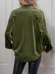 Rear view of dark green velvet long sleeve shirt with relaxed fit and glossy texture