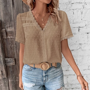 Detail of V-neck short sleeve shirt with Swiss dot texture and lace trim edges