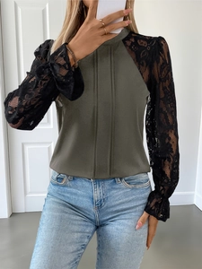 Detail of army green pleated bodice with black crochet lace sleeves and ruffled cuffs