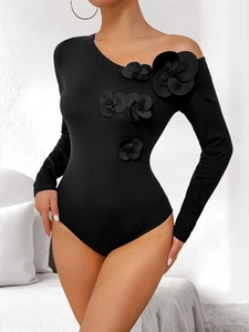 Black long sleeve bodysuit featuring 3D floral appliqués and asymmetric off-shoulder neck