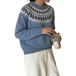 Women's blue Fair Isle knit sweater with geometric pattern and casual round neck style