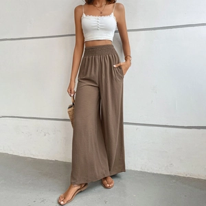 Women's white lace crop top and brown high-waisted wide-leg trousers casual summer outfit