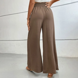 Women's wide leg trousers in dark brown featuring a smocked elastic high waist and draped fit