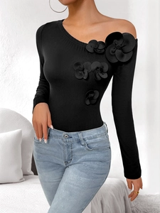 Slim fit black one-shoulder long sleeve bodysuit with 3D floral accents on the neckline