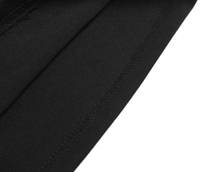 Close-up detail of neat overlock stitching on black lace long sleeve hooded dress fabric