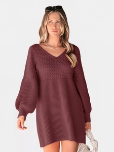 Detail of burgundy V-neck knit mini dress showing waffle texture and lantern sleeves