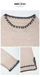 Detail of pink knitted sweater showing round neck, sleeve cuffs and side split hem details