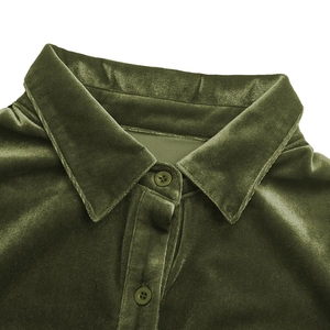 Detail of olive green velvet shirt collar with matching resin buttons and textured fabric