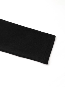 Close-up of black long sleeve cuff with high-quality double-needle flat lock stitching