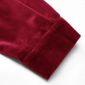 Detail of the high-quality velvet fabric and clean stitching on the burgundy sleeve cuff