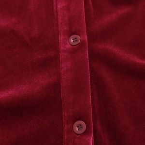 Detail of red velvet shirt with vertical placket and matching four-hole resin buttons