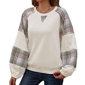 Women's crewneck color block sweatshirt with plaid raglan sleeves and ribbed texture