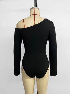Detail view of the black one-shoulder long sleeve bodysuit on a mannequin
