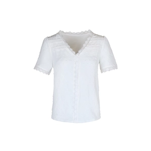 Close-up of white Swiss dot blouse with elegant lace V-neck and hollow-out detailing