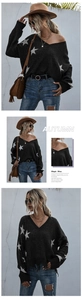 Detail of V-neck black knit sweater with white star pattern and stylish fringe accents