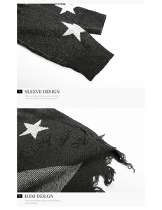 Detail of ribbed cuffs and distressed hem on the dark star pattern knit sweater