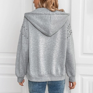 Women's light grey hooded sweatshirt featuring silver stud details on sleeves and back