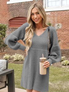 Close-up of gray knit V-neck dress showing mixed waffle and ribbed texture details