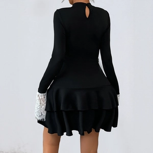 Elegant black long sleeve mini dress with lace cuffs and ruffled hem back view