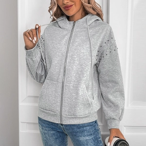 Women's grey zip-up hoodie with studded shoulders and soft fleece lining for autumn