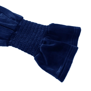 Detailed view of deep blue velvet dress sleeve with elastic shirring and ruffled cuffs