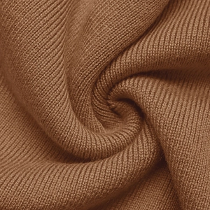 Detailed macro view of brown ribbed knit fabric texture with soft elastic fiber weaving