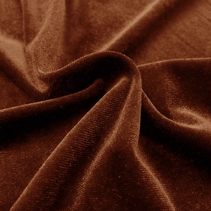 Close-up of premium chocolate brown velvet fabric showing soft texture and rich drape