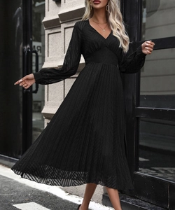 Detail of high waist V-neck black midi dress with lantern sleeves and pleated jacquard fabric