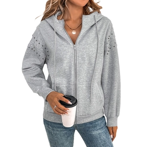 Women's light grey hooded zip-up sweatshirt with silver rivet detailing on sleeves
