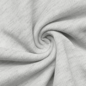 Macro shot of grey heather knit fabric showing jersey texture and soft drape