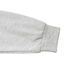 Detailed macro view of the grey heather knit fabric and ribbed cuffs on the sleeve